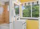 Well-lit bathroom with a vanity and a combination bathtub and shower at 6545 W 84Th Way # 132, Arvada, CO 80003