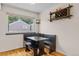 A dining area with a built-in bench, wine rack and a window at 6545 W 84Th Way # 132, Arvada, CO 80003