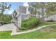 View of the exterior of the townhomes and surrounding grass at 6545 W 84Th Way # 132, Arvada, CO 80003