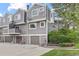 Exterior view of the townhome, showcasing the garage and gray siding at 6545 W 84Th Way # 132, Arvada, CO 80003