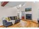 Cozy living room with a fireplace, hardwood floors and lots of natural light at 6545 W 84Th Way # 132, Arvada, CO 80003