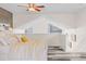 Bright main bedroom features white trim, unique ceilings, and a bed with a yellow patterned coverlet at 6545 W 84Th Way # 132, Arvada, CO 80003