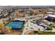 Aerial view of the community recreation center featuring tennis courts and a modern skate park at 4311 Del Rio Ct, Denver, CO 80239