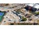 Aerial view of a skate park and playground surrounded by landscaping and trees next to a large building at 4311 Del Rio Ct, Denver, CO 80239