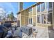 Backyard patio area featuring grill, seating area and high ceiling at 4311 Del Rio Ct, Denver, CO 80239