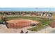 Aerial view of a well-maintained baseball field with covered benches, suitable for community sports at 4311 Del Rio Ct, Denver, CO 80239