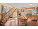 Bright dining area featuring hardwood floors, stairs, and seamless transition to the kitchen for easy entertaining at 4311 Del Rio Ct, Denver, CO 80239