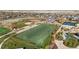 Overhead view showcasing athletic fields including soccer, baseball, and tennis amidst lush greenery and community spaces at 4311 Del Rio Ct, Denver, CO 80239