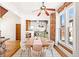 Open concept dining room leading to a kitchen with green cabinets at 3217 Irving St, Denver, CO 80211