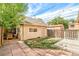 Detached garage with a private backyard, grass, and a stone path at 3217 Irving St, Denver, CO 80211