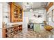 Bright kitchen with stainless steel appliances, green cabinets, and hexagon flooring at 3217 Irving St, Denver, CO 80211