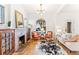 Bright living room with hardwood floors, fireplace, and a charming arched window to the front porch at 3217 Irving St, Denver, CO 80211