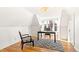 Bright home office with hardwood floors, a modern rug, and a built-in desk by the window at 3217 Irving St, Denver, CO 80211