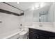 Clean bathroom with tub and shower combination, and dark vanity at 1121 Albion St # 804, Denver, CO 80220