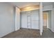 Bedroom featuring carpet and an open closet with shelving for optimal storage and organization at 1121 Albion St # 804, Denver, CO 80220