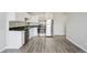 Kitchen featuring stainless steel appliances, granite countertops, mosaic tile backsplash, and white cabinets at 1121 Albion St # 804, Denver, CO 80220