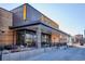 Exterior shot of Postino restaurant, featuring modern architecture, outdoor seating, and inviting ambiance on a sunny day at 1121 Albion St # 804, Denver, CO 80220