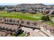 Stunning aerial view of the homes, showcasing the lush green spaces surrounding the community at 1344 Royal Troon Dr, Castle Rock, CO 80104