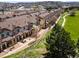 Aerial shot of townhomes with beautiful golf course views, surrounded by lush greenery at 1344 Royal Troon Dr, Castle Rock, CO 80104