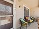 Cozy front porch seating area, perfect for enjoying the outdoors and relaxing in style at 1344 Royal Troon Dr, Castle Rock, CO 80104