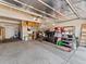 Garage interior with storage shelving, exposed ceiling and concrete floors at 1344 Royal Troon Dr, Castle Rock, CO 80104
