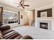 Inviting living room with a fireplace, large window, and plush carpeting at 1344 Royal Troon Dr, Castle Rock, CO 80104