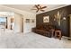 Comfortable living room with a modern accent wall and plush carpeting at 1344 Royal Troon Dr, Castle Rock, CO 80104