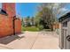 Spacious backyard with a sports court and well-maintained lawn at 9141 Roundtree Dr, Highlands Ranch, CO 80126