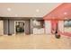 Spacious basement with a mirrored wall, kitchenette, and workout area at 9141 Roundtree Dr, Highlands Ranch, CO 80126