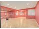 Finished basement with a workout area, mirrored wall, and bright pink accents at 9141 Roundtree Dr, Highlands Ranch, CO 80126