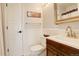 Neat bathroom featuring updated vanity, toilet, mirror, and towel bar at 9141 Roundtree Dr, Highlands Ranch, CO 80126