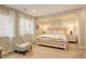 Inviting bedroom featuring large windows, neutral tones, and soft textures at 9141 Roundtree Dr, Highlands Ranch, CO 80126