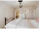 Charming bedroom with a black wrought iron bed frame and decorative light fixture at 9141 Roundtree Dr, Highlands Ranch, CO 80126