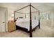 Comfortable bedroom with a large bed, ample lighting, and a view of the outdoors at 9141 Roundtree Dr, Highlands Ranch, CO 80126