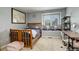 Bright bedroom with a window seat, a world map, and a cozy spot for reading or relaxing by the natural light at 9141 Roundtree Dr, Highlands Ranch, CO 80126