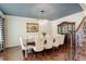 Elegant dining room featuring a crystal chandelier, and seating for eight at 9141 Roundtree Dr, Highlands Ranch, CO 80126