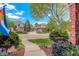 Landscaped front yard featuring flowers, walkway, and partial view of home exterior at 9141 Roundtree Dr, Highlands Ranch, CO 80126