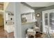 Bright kitchen with a breakfast bar, white cabinets, granite countertops and stainless steel appliances at 9141 Roundtree Dr, Highlands Ranch, CO 80126