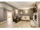 Finished basement living room featuring tile flooring, a fireplace, and modern decor at 9141 Roundtree Dr, Highlands Ranch, CO 80126