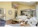 Bright living room boasts hardwood floors, high ceilings, and an abundance of natural light at 9141 Roundtree Dr, Highlands Ranch, CO 80126