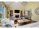 Inviting living room with fireplace, built-ins, and large windows at 9141 Roundtree Dr, Highlands Ranch, CO 80126