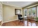 Office featuring a stylish desk, a comfortable chair, and bay windows at 9141 Roundtree Dr, Highlands Ranch, CO 80126