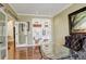 Charming office space with hardwood floors, built-in shelving, and glass French doors at 9141 Roundtree Dr, Highlands Ranch, CO 80126