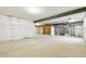 Unfinished basement featuring high ceilings and exposed utilities, ready for customization at 9329 Russell Cir, Arvada, CO 80007