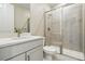 Bathroom featuring glass shower, vanity sink, and tile flooring at 9329 Russell Cir, Arvada, CO 80007