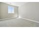 Bright bedroom with a window offering natural light and plush carpeting for comfort at 9329 Russell Cir, Arvada, CO 80007