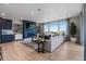 Bright and airy living room with a fireplace, large windows, and stylish decor at 9329 Russell Cir, Arvada, CO 80007