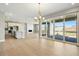 Open-concept living area features a fireplace, recessed lighting, and sliding glass doors to the patio at 9329 Russell Cir, Arvada, CO 80007