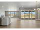 Bright living room with sliding glass doors to the patio, recessed lighting, and an open floor plan at 9329 Russell Cir, Arvada, CO 80007