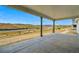 Covered patio showcasing concrete flooring, mountain views, and neighborhood park at 9329 Russell Cir, Arvada, CO 80007